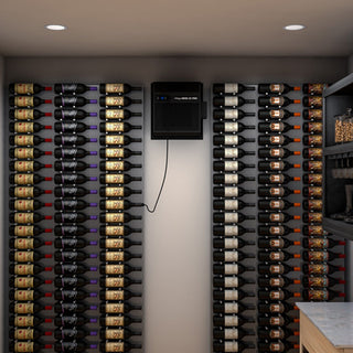WhisperKOOL SC Pro 3000 cooling unit with a bottle probe, wall-mounted in a wine cellar for precise temperature control and optimal wine storage.