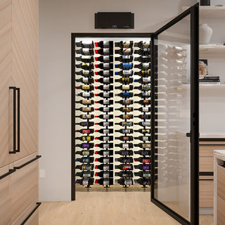 caption Slimline LS cooling unit installed above glass entry in sleek wine cellar