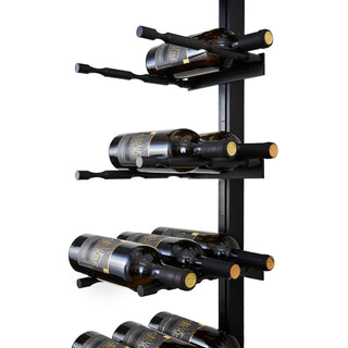 Caption Close-up of matte black wine rack with label-forward, triple-deep Pegs