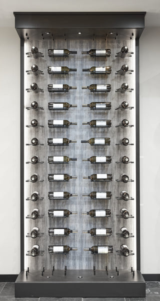Float glass and cable wine racks store label view and cork forward bottles in four columns inside an open lit showcase 