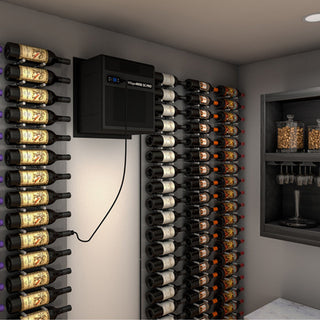 WhisperKOOL SC Pro 4000 cooling unit with a bottle probe, mounted on a wine cellar wall, with racks of horizontally stored wine bottles and hanging glassware.